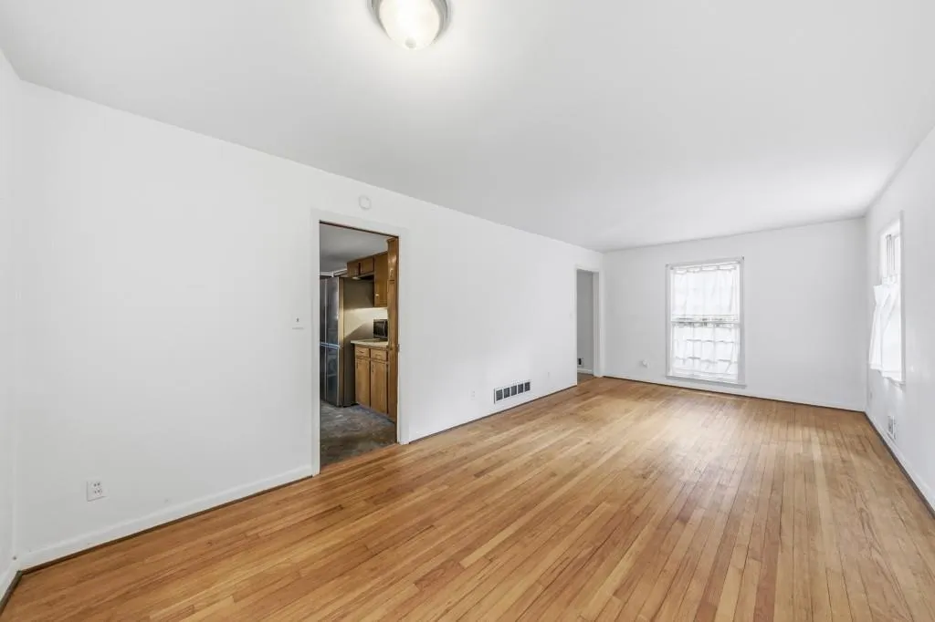 Dining/Living Room combo with hardwood floors