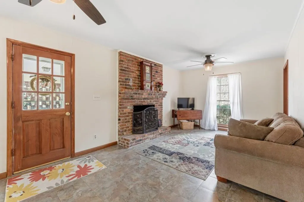 Keeping/Family Room with brick fireplace and ceramic tile floors