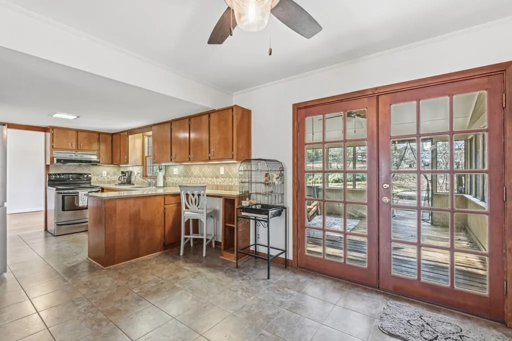 Eat-in kitchen with French doors to the screened in porch