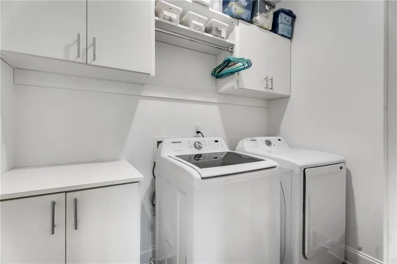 Laundry room featuring cabinet space and washing machine and dryer