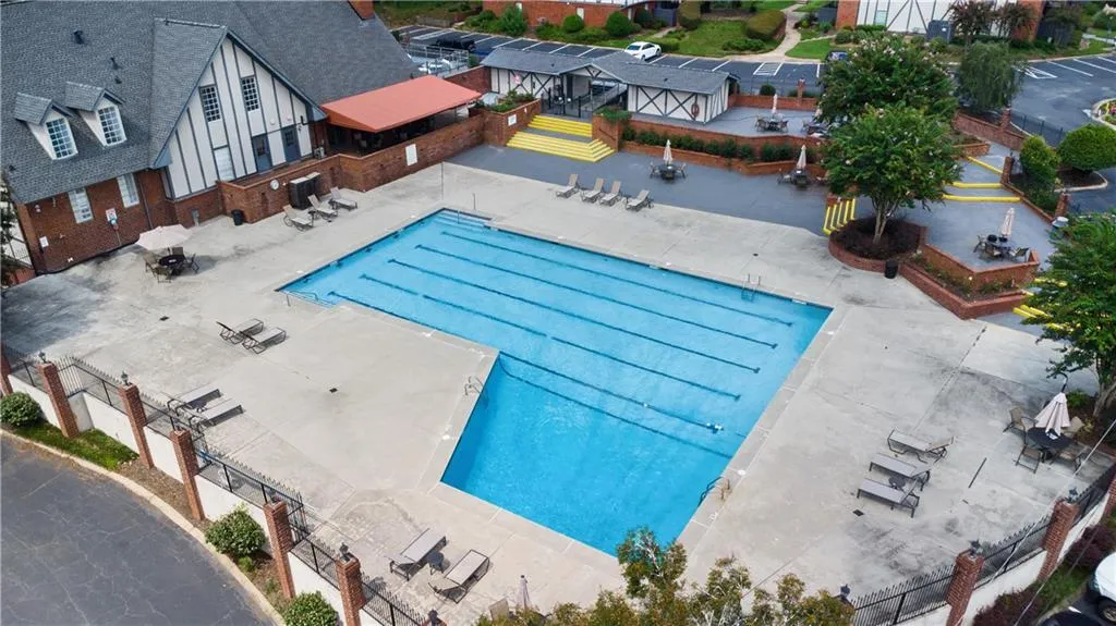 Community pool with a patio
