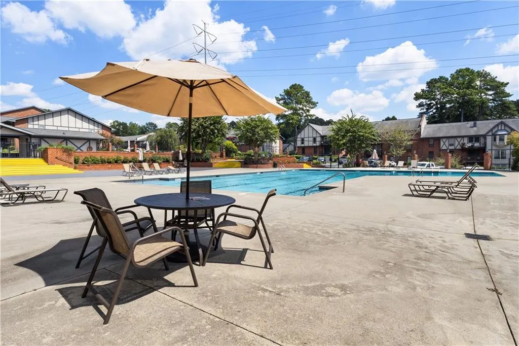 Community pool featuring a patio area