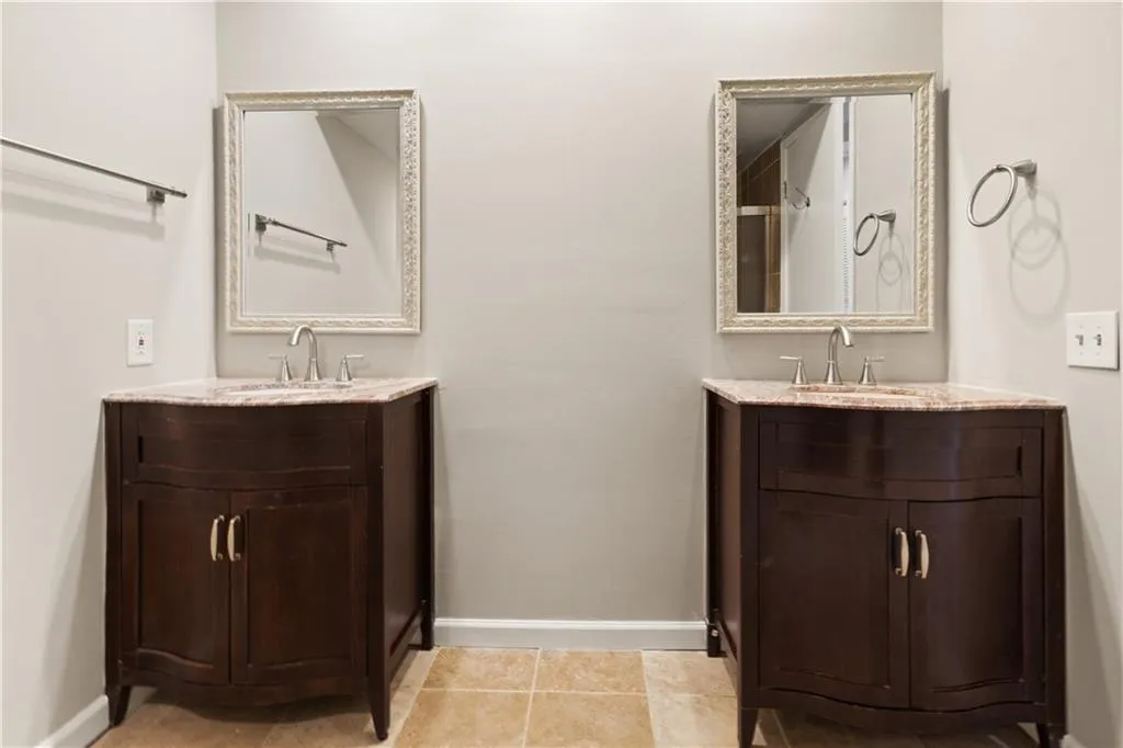 Bathroom featuring two vanities