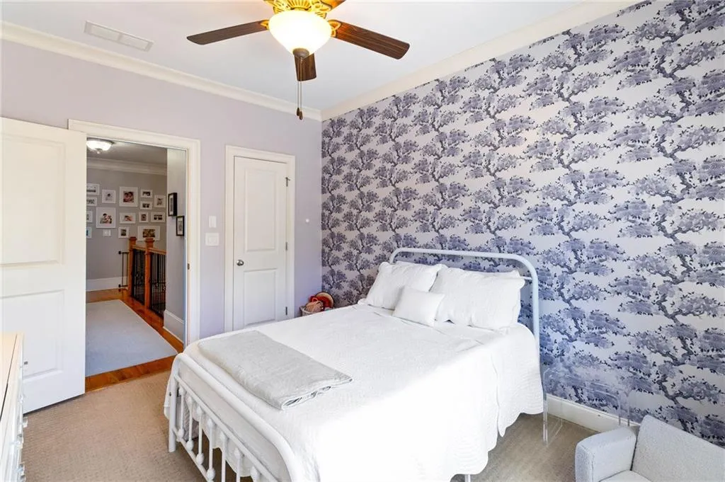 Bedroom with ceiling fan and crown molding