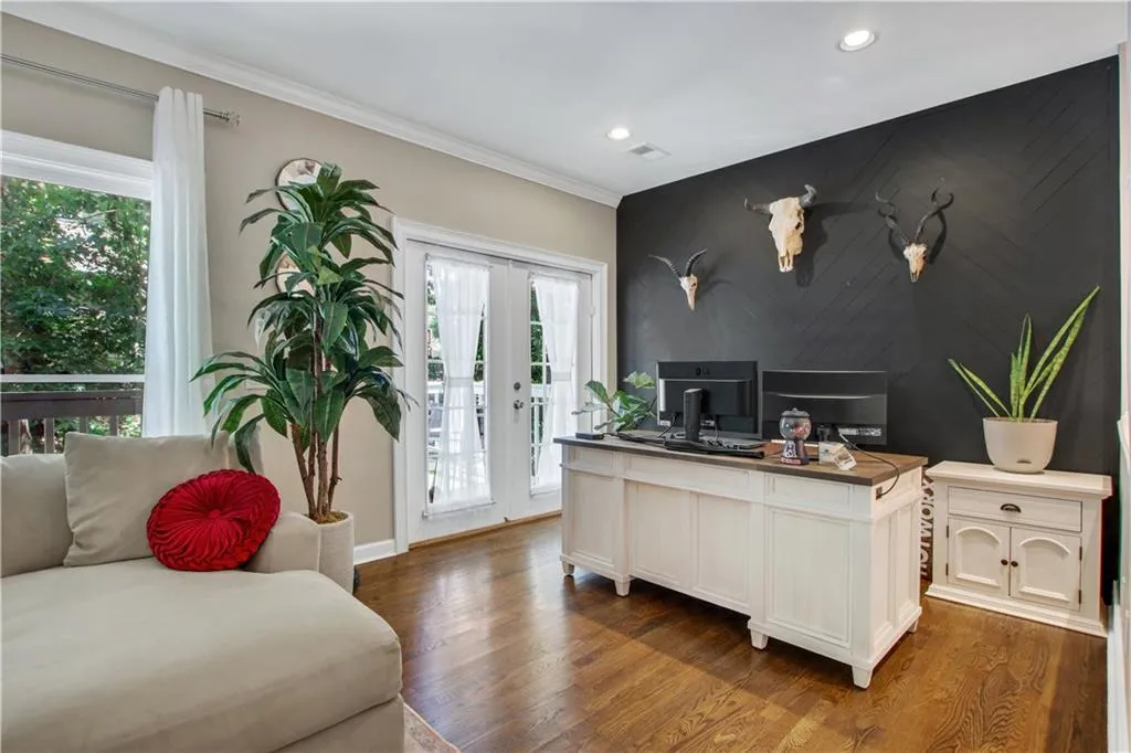 Office with plenty of natural light and hardwood / wood-style floors