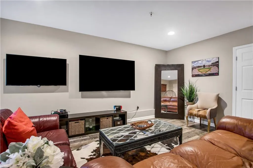 Living room with hardwood / wood-style flooring