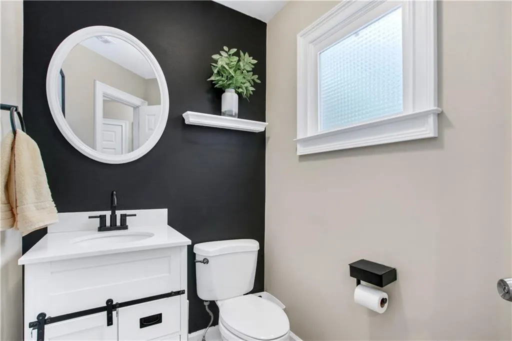 Bathroom with vanity and toilet