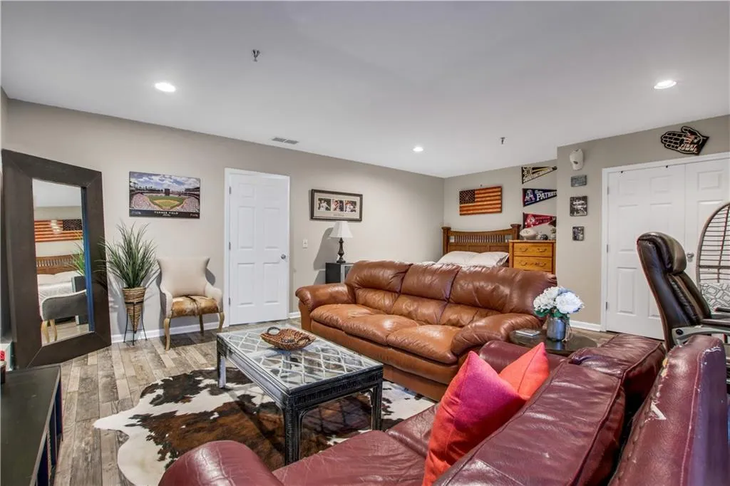 Living room with hardwood / wood-style flooring