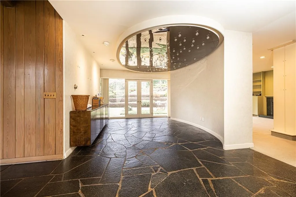 Oval dining room opens to flat back patio