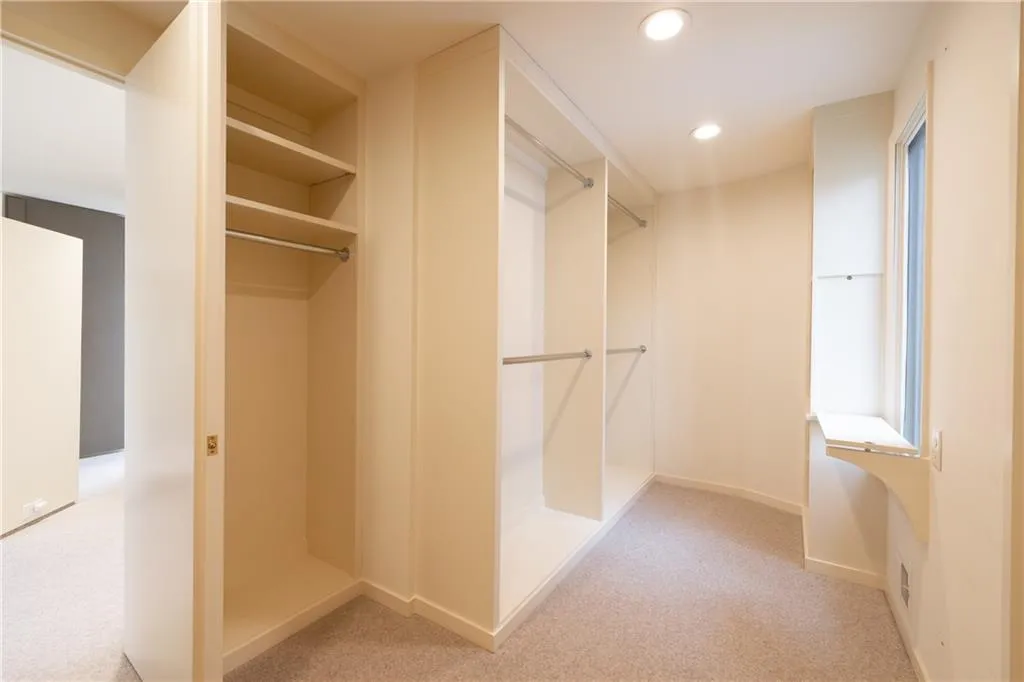 Primary bedroom walk in closet