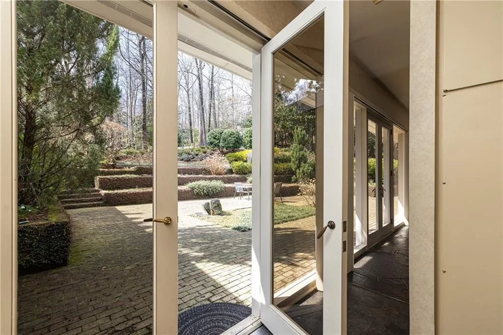 Main level walk out gorgeous patio and gardens