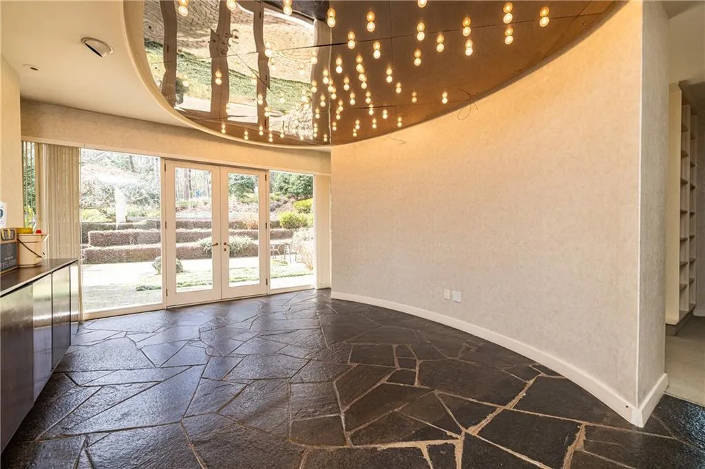 Oval dining room opens to flat back patio