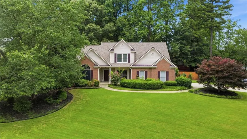 Brick and siding exterior with a gabled roof