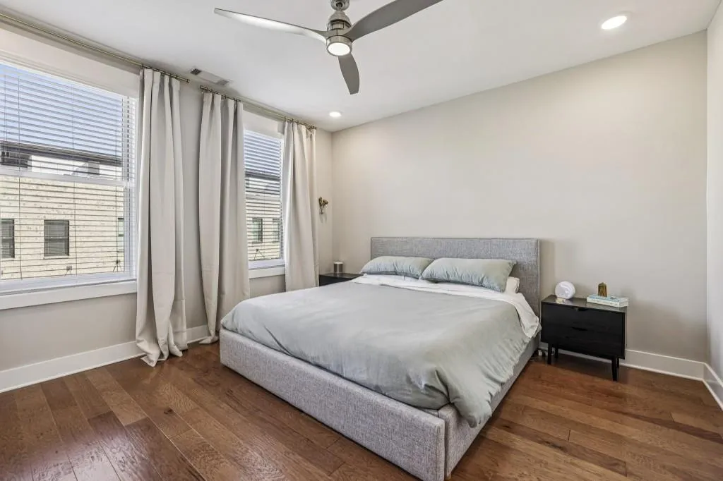 The Primary Suite is a luxurious retreat with a Double Stone Vanity, Glass-Enclosed Shower, and a Large Walk-In Closet.