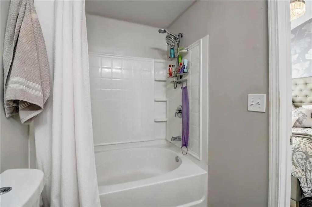 Bathroom with toilet and shower / tub combo