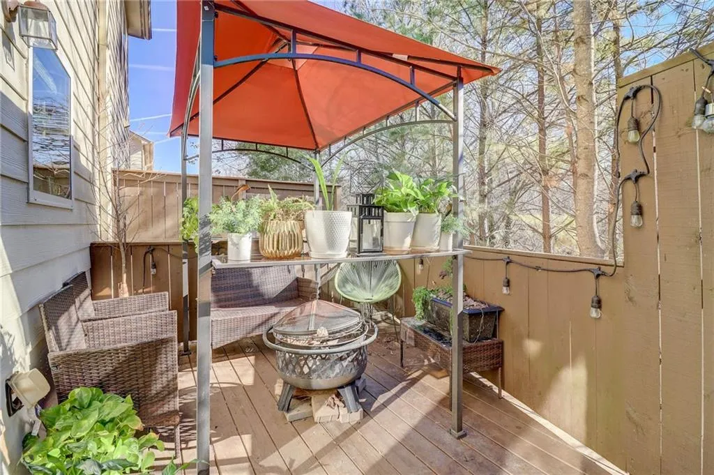 Wooden deck featuring an outdoor fire pit