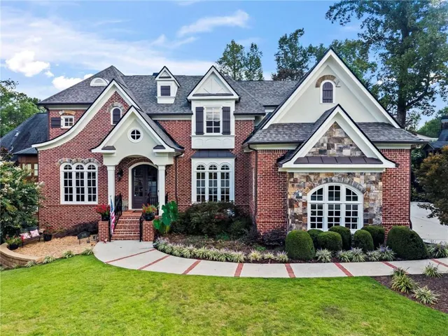 Brick exterior with stone accents and multiple gables