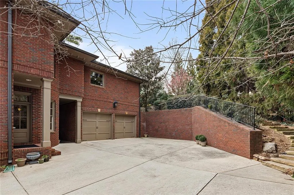 View of property exterior with garages