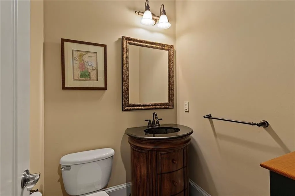 Bathroom featuring vanity and toilet