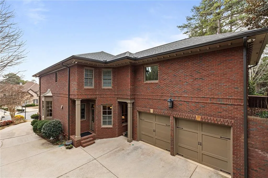 View of side facade featuring two garages