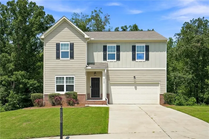 Two-story exterior with mixed siding and brick accents