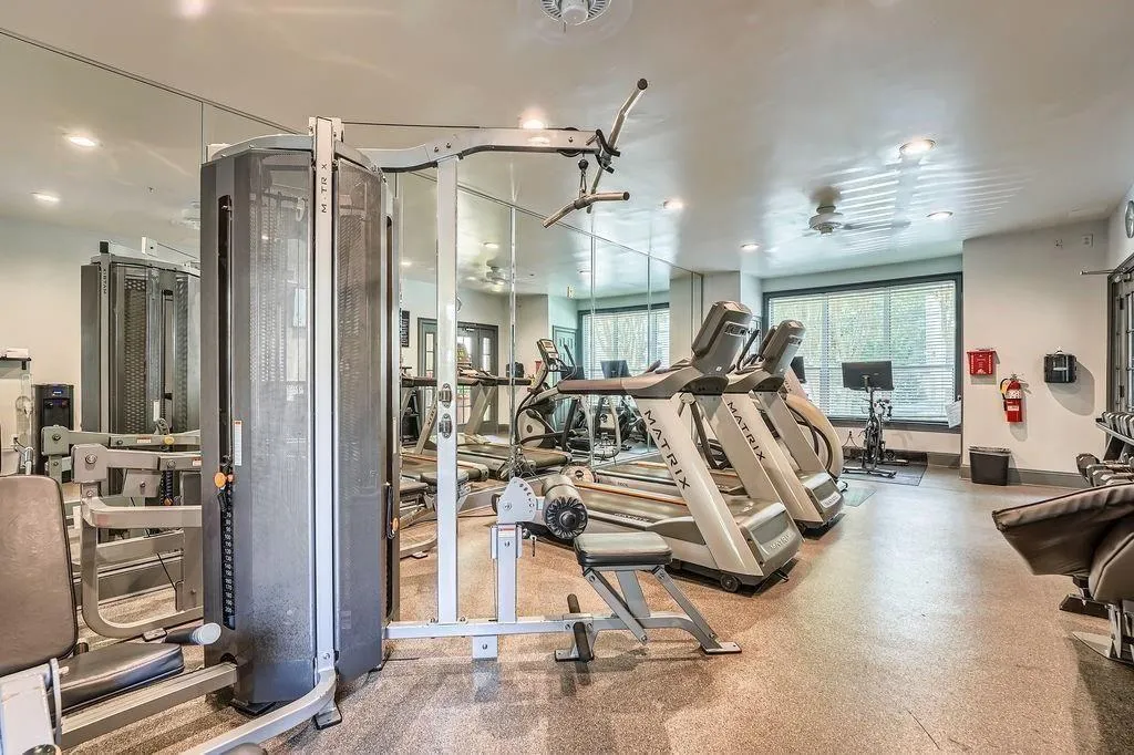Workout area featuring healthy amount of natural light and recessed lighting