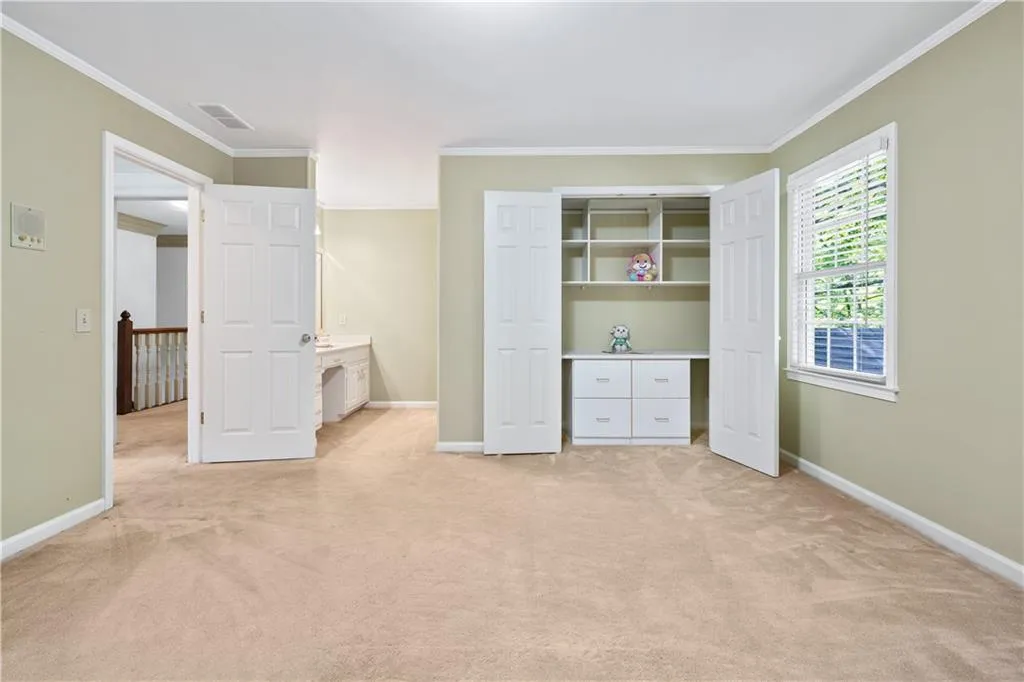 Secondary Bedroom with custom California Closet