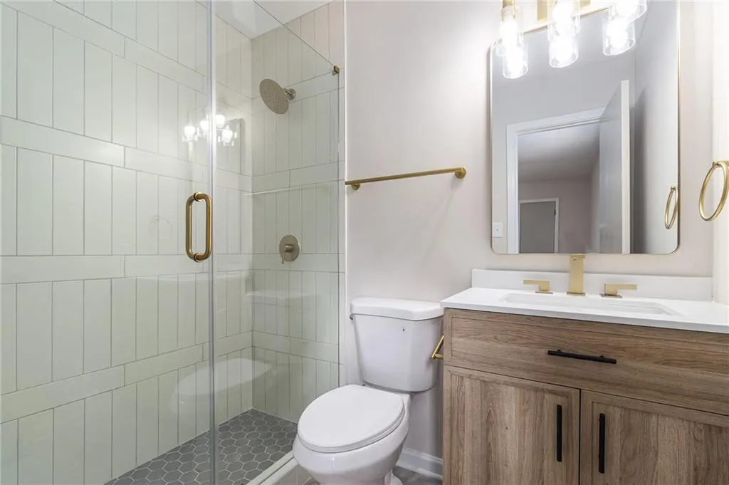 Bathroom with vanity and a stall shower