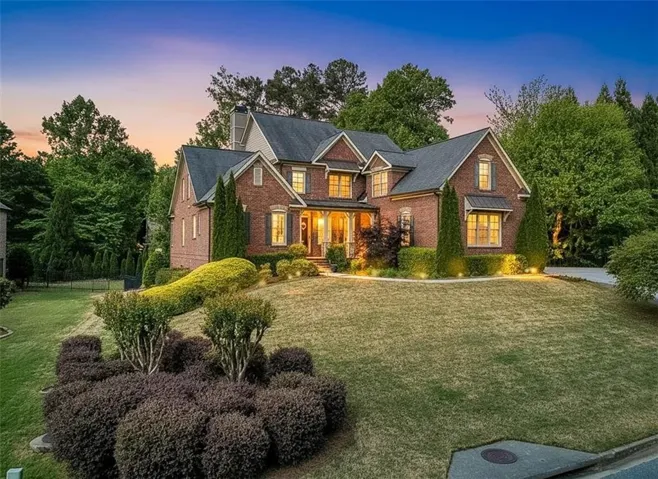 Brick exterior with multiple gables and dormer windows