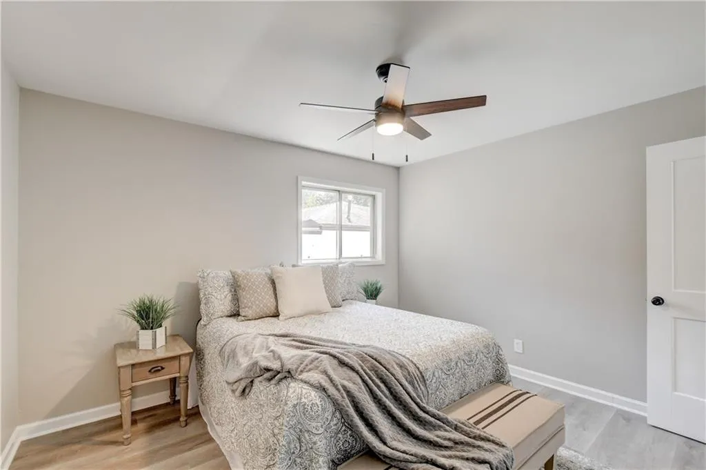 Bedroom with light wood-style flooring and ceiling fan