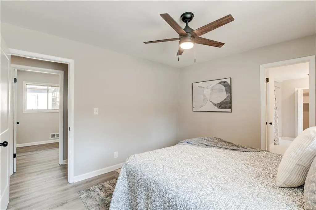 Bedroom featuring light wood-type flooring and ceiling fan