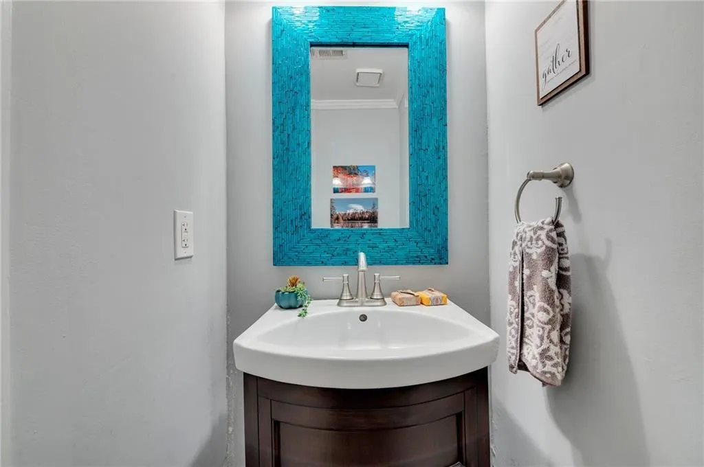 Bathroom with vanity and crown molding