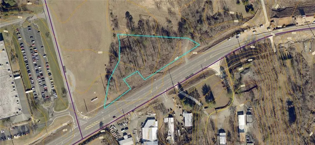 Aerial map of property and surrounding area featuring property parcel outlined