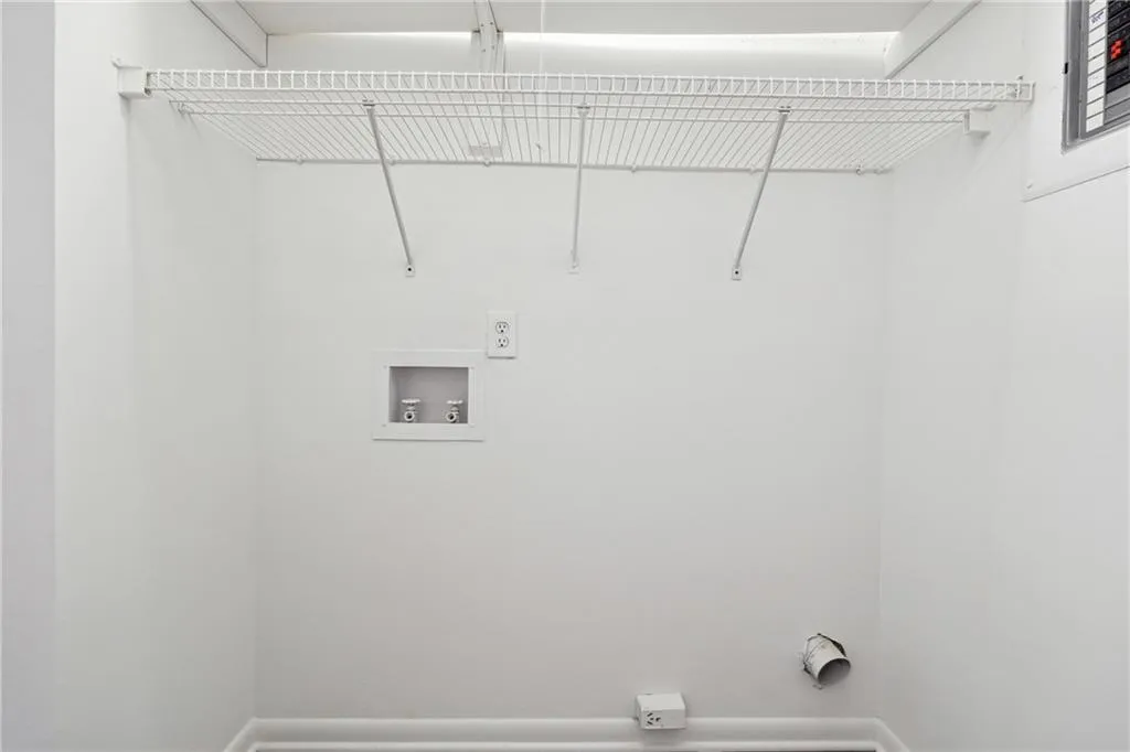 Washroom with washer hookup and electric dryer hookup