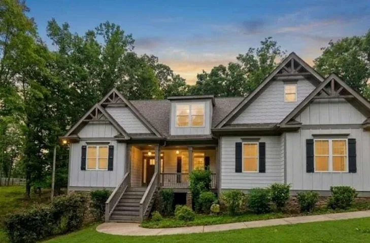 Craftsman-style exterior with gabled roof lines and decorative trusses