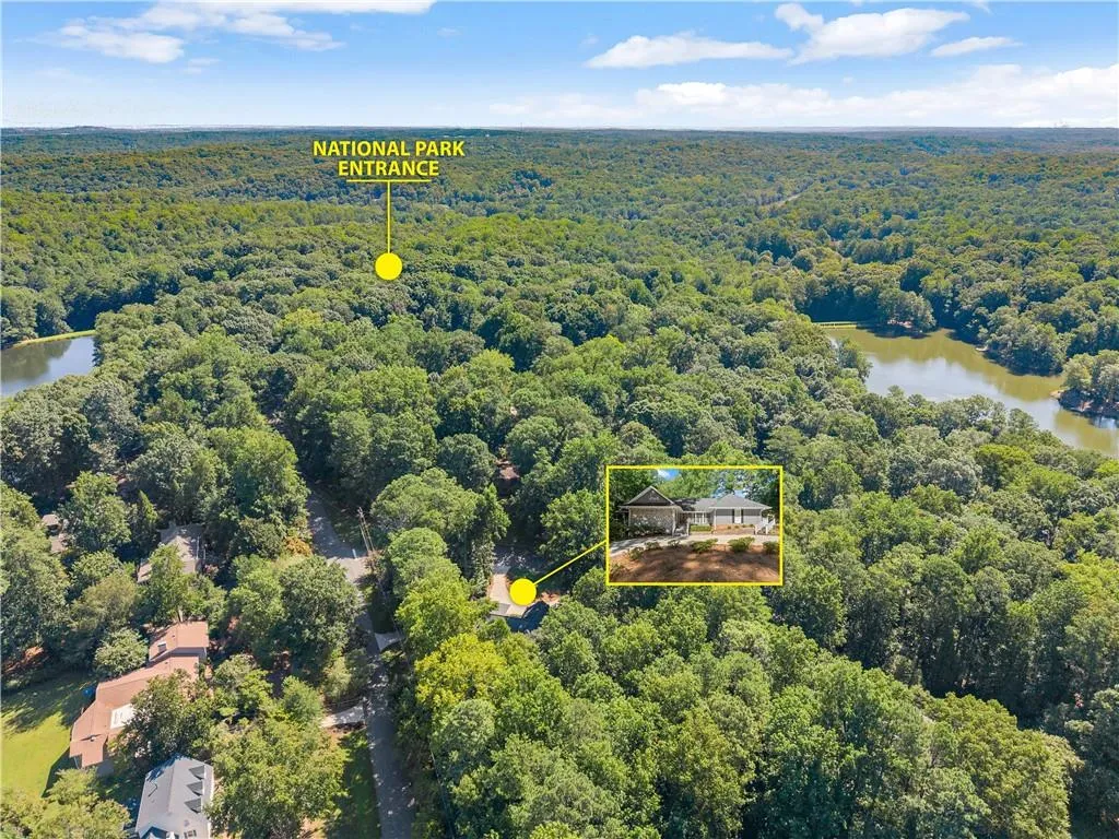 View of property location with property parcel outlined and a nearby body of water