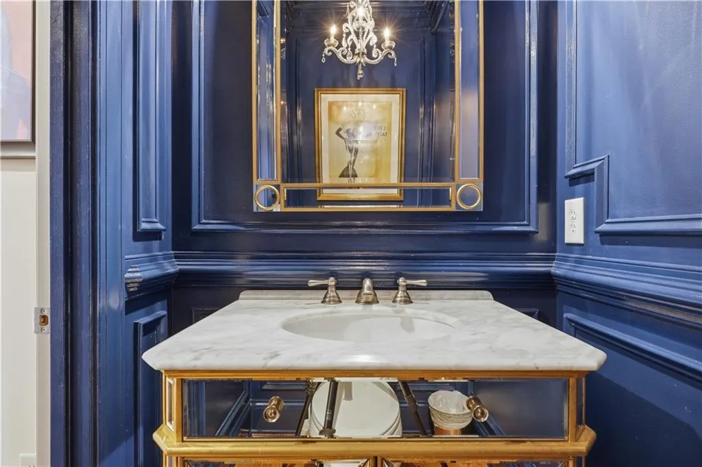 5.Bathroom with vanity and suspended lighting