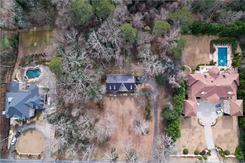 Aerial overview of property's location featuring a pool area