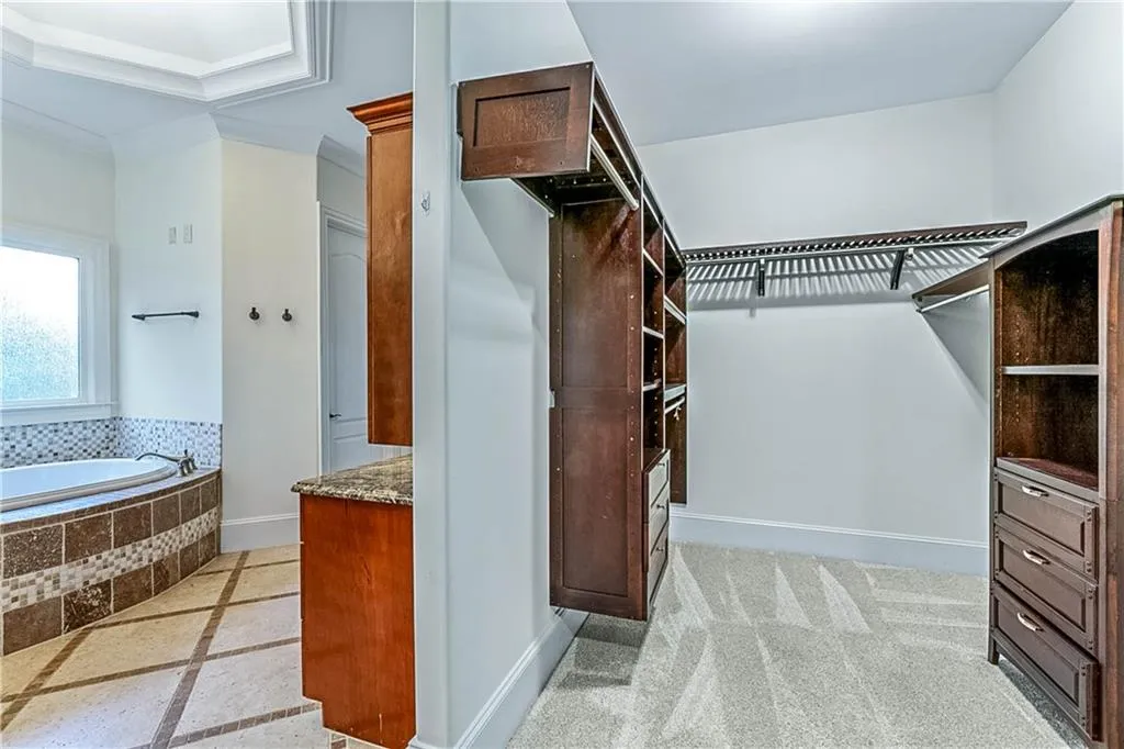 Spacious closet with inlaid floor details
