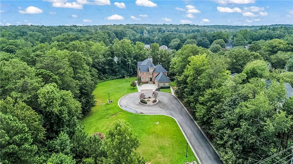 View from above of property with a heavily wooded area