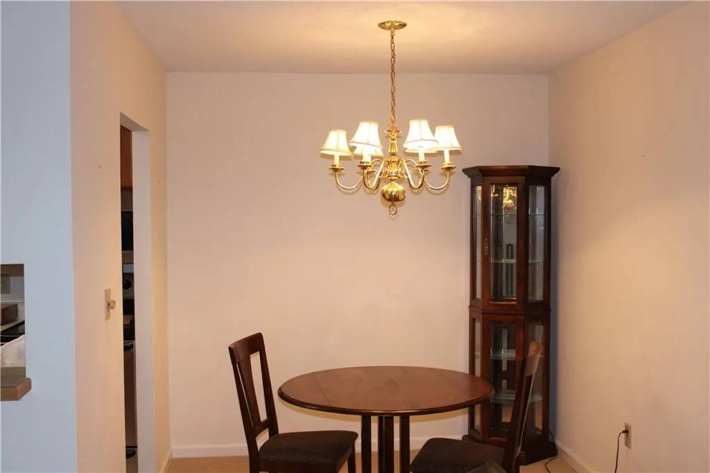 Dining space with a chandelier