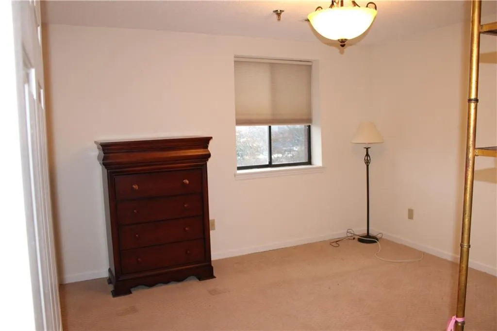 Bedroom with carpet.