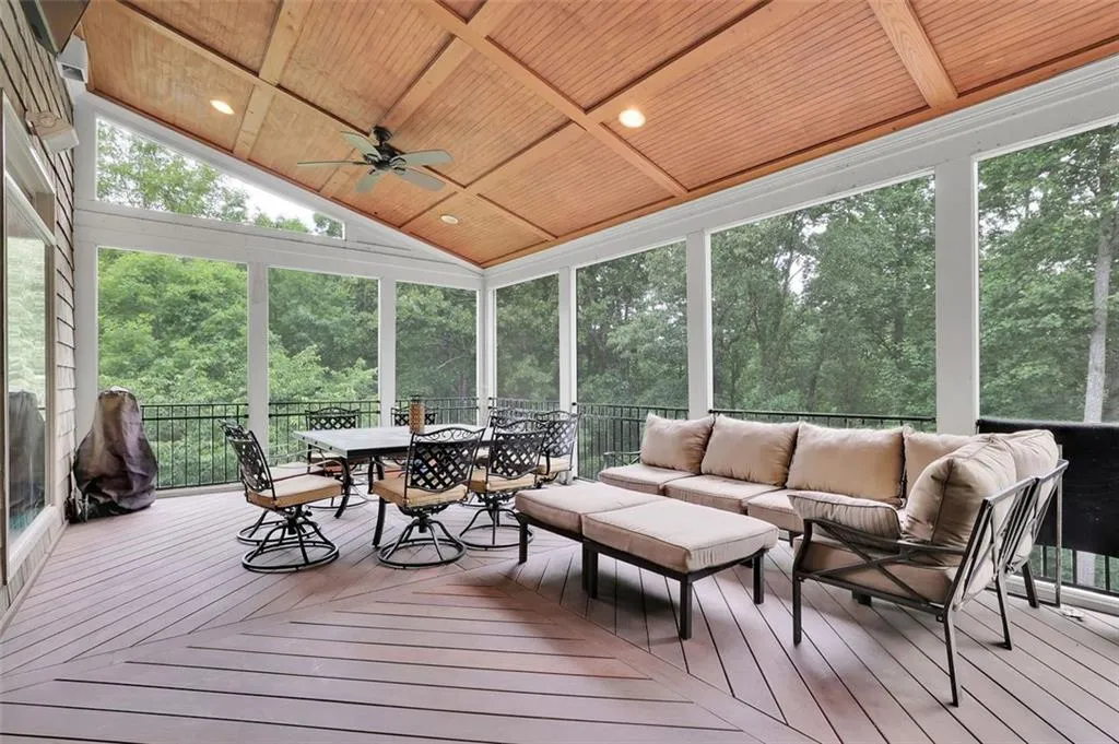 Screened porch with chimnea, ceiling fans, vaulted wooden ceilings, off kitchen with plenty of natural light