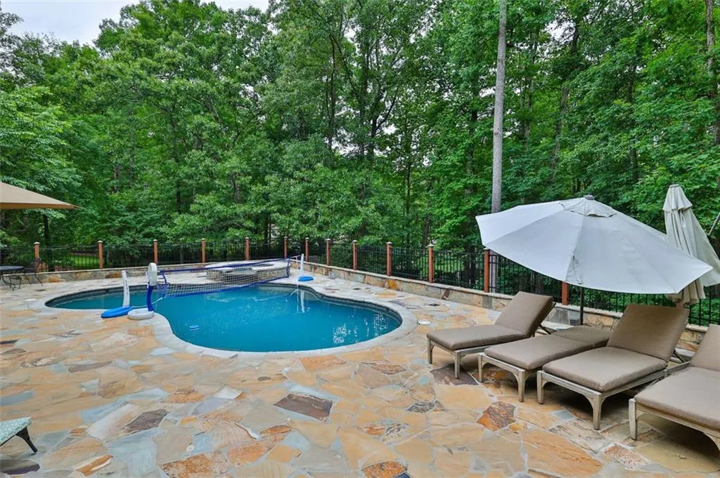 View of swimming pool and more seating