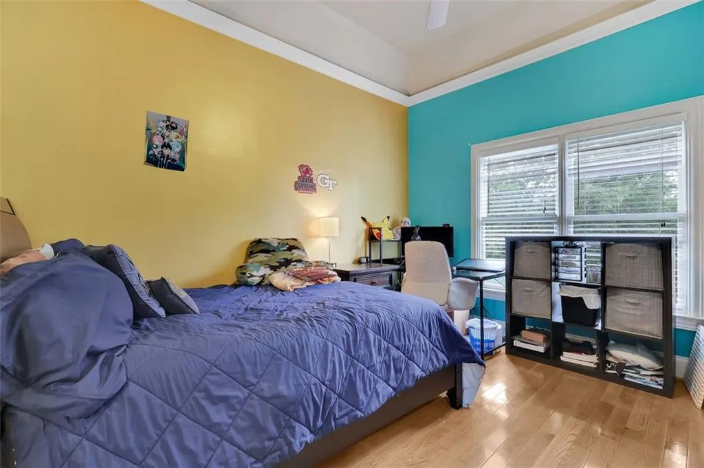 Bedroom featuring ceiling fan and light hardwood / wood-style floors