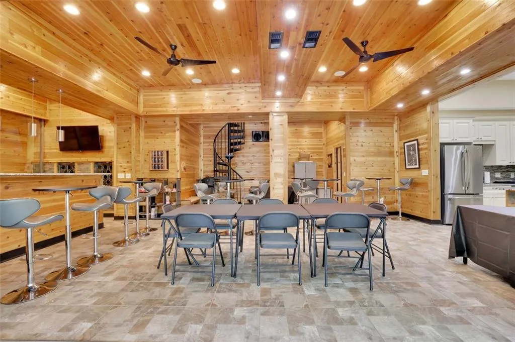 Recreation Room (sub basement level)  Tiled recreation room with wood ceiling and wooden walls