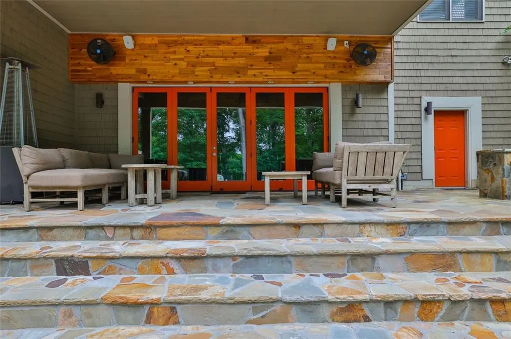 View of patio area (sub basement/pool level) with seating