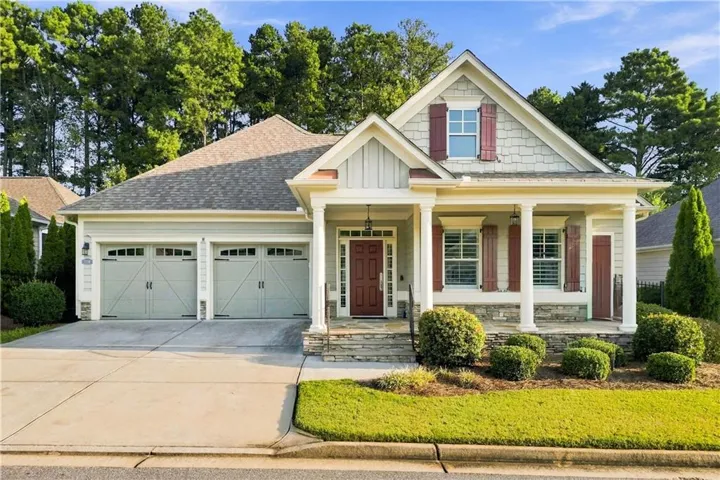 Craftsman-style exterior with stone accents and a covered front porch