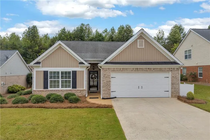 Brick and siding exterior with a gabled roof