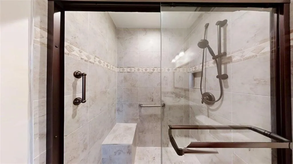 Full bathroom with tiled shower